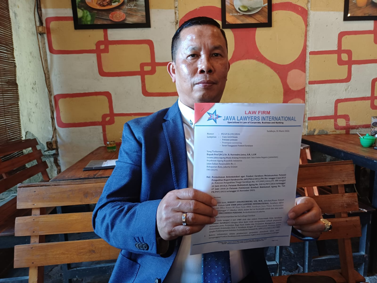 Kuasa hukum PT Unicomindo Perdana, Robert Simangunsong. (Istimewa)